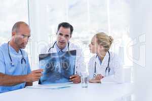 Team of doctor looking at Xray