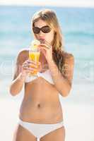 blonde drinking a cocktail