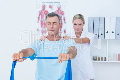 Doctor examining her patient back