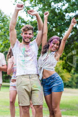 Happy friends covered in powder paint