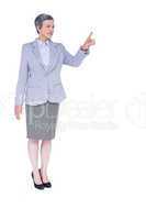 A serious businesswoman with grey hair gesturing