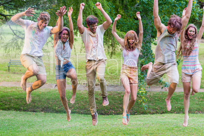 Happy friends covered in powder paint