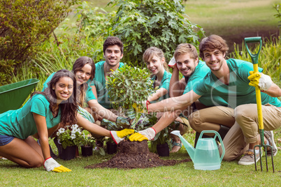 Happy friends gardening for the community