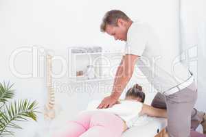 Physiotherapist doing back massage