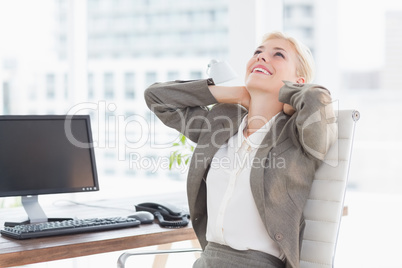 Businesswoman relaxing in a swivel chair