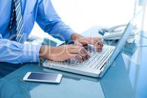 Businessman using his laptop