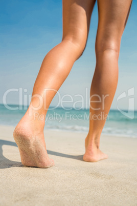 Feet of woman at the beach