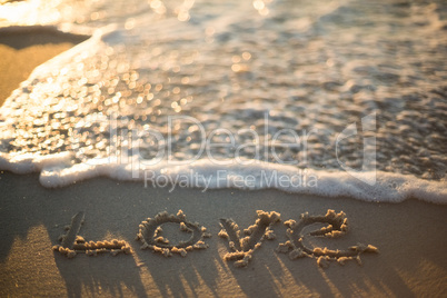 love written on the beach