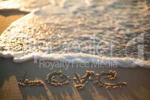 love written on the beach