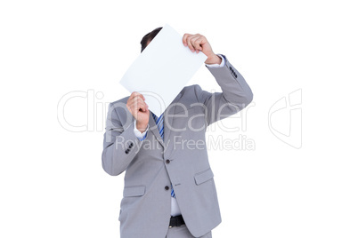 Businessman holding blank sign in front of his head