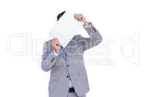 Businessman holding blank sign in front of his head