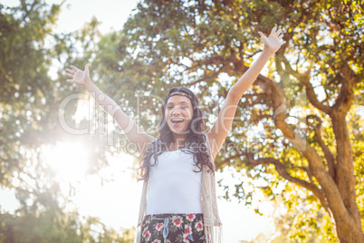 Pretty hipster felling free in the park