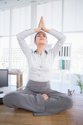 Businesswoman relaxing on her desk