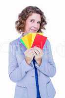 A businesswoman holding colors cards