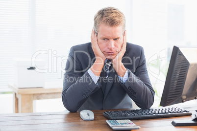 Depressed businessman at his desk