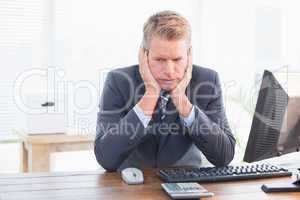 Depressed businessman at his desk