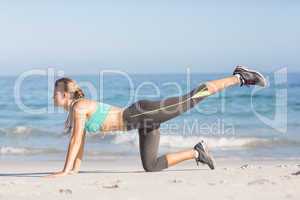 Fit woman stretching her leg