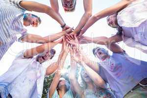 Happy friends covered in powder paint