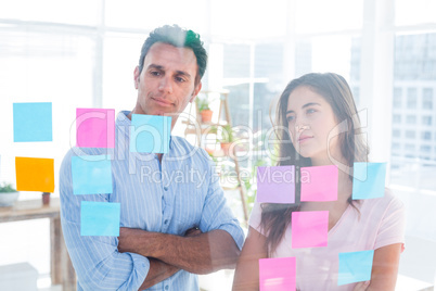 Young creative business people looking at photo editor Young creative business people looking at photo editor