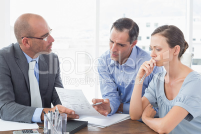 Businessman explaining contract to business partners