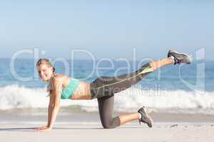 Fit woman stretching her leg