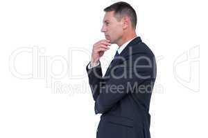 Serious businessman thinking with hand on chin