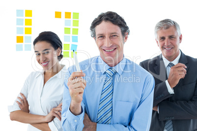 Smiling business people brainstorming together