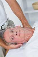 Man receiving neck massage