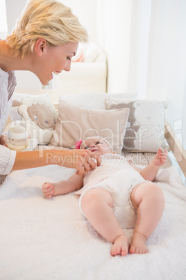 Happy mother with her baby girl