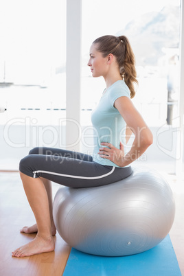 Woman sitting on exercise ball