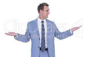 A businessman with arms up