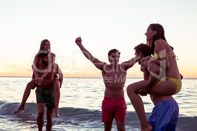 Happy friends having fun in the water