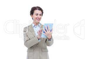 Businesswoman smiling while looking at a tablet