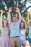 Happy friends covered in powder paint