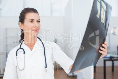 Concentrated doctor looking at Xray