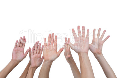 People raising their hands in the air