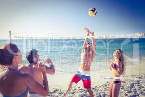 Friends playing volleyball