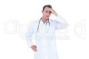 Worried young doctor in white tunic