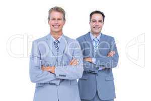 Business team standing arms crossed