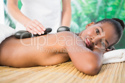 Pretty woman enjoying a hot stone massage