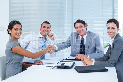 Business team greeting each other