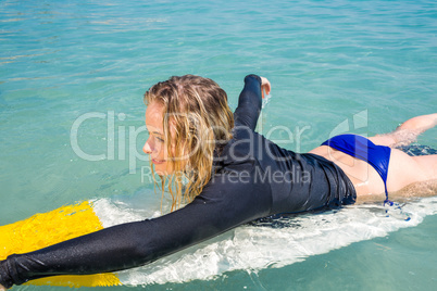 woman with a surfboard on a sunny day woman with a surfboard on a sunny day