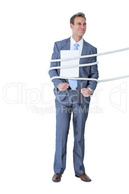 A businessman tie up by rope