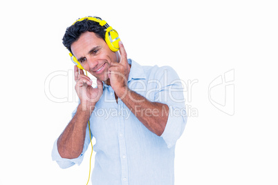 Handsome man listening music with headphone