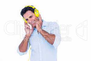 Handsome man listening music with headphone