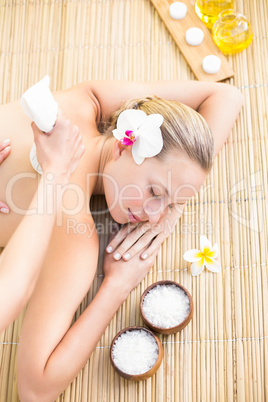 Attractive woman getting massage on her back