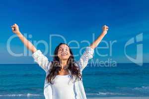 Happy woman smiling at the beach