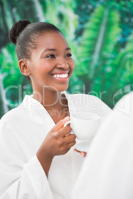 Close up of a beautiful young woman drinking coffee