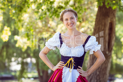 Pretty oktoberfest blonde smiling in the park