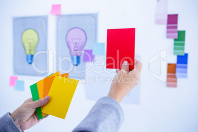 Creative businesswoman holding color cards